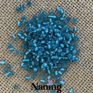 Kásagyöngy - ezüstközepű - átlátszó tengerzöld - 4mm